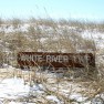 The buried sign is testament to the shifting sands of an active freshwater dune system at White River Township's sanctuary.