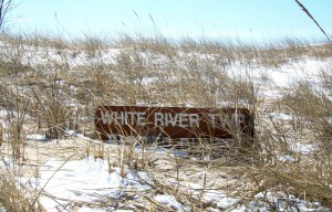 The buried sign is testament to the shifting sands of an active freshwater dune system at White River Township's sanctuary.